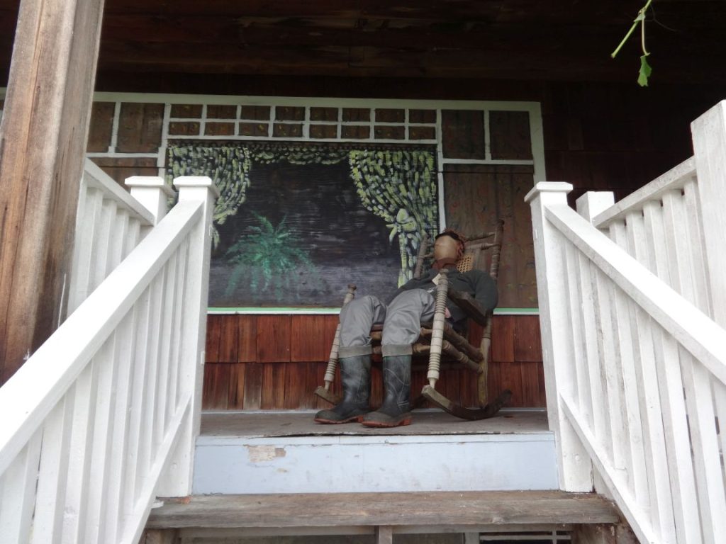 Porch window painting and "Mack" in rocker